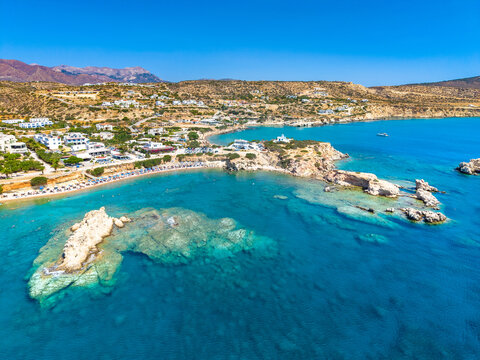 View of sea bay with beautiful beach and traditional church on Karpathos island in Ammopi village, Greece
