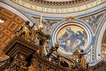 Rome, Italy - March 30, 2026 - Angels with crown and cross on top of the baldachin inside Saint Peters Basilica Rome © imagoDens