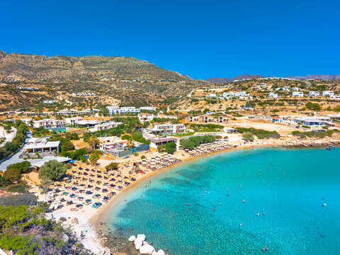 View of sea bay with beautiful beach and traditional church on Karpathos island in Ammopi village, Greece