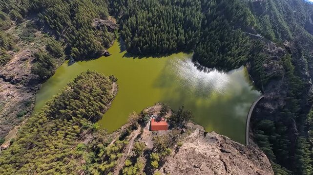 Drone shot of the scenic Mountain Reservoir Presa de Los Hornos in the mountains of Gran Canaria. 