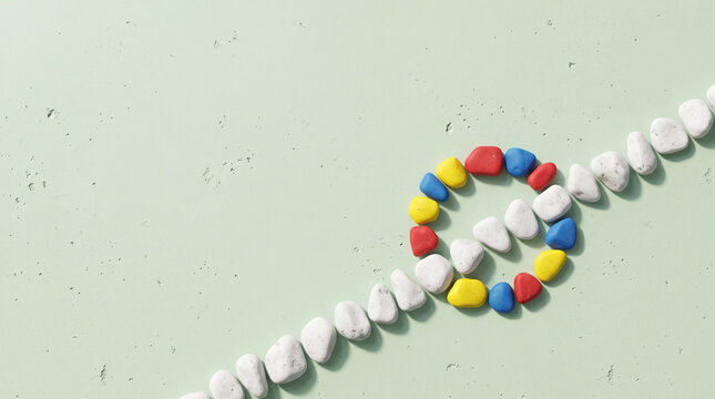 Thinking outside the box and neurodiversity concept with colorful pebbles