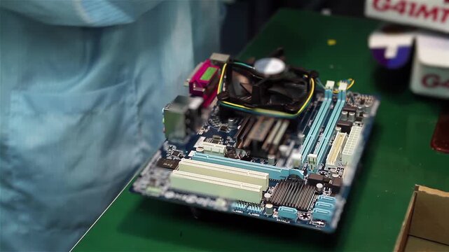 Technician Installing CPU Cooler and RAM Memory on Computer Motherboard Close Up - 4K