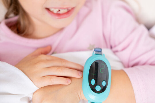 Child, Young girl undergoing electromagnetic pulse therapy, tingling sensation in hand, medical care, rehabilitation or physiotherapy, health monitoring, pediatric care, modern wellness tech for kids