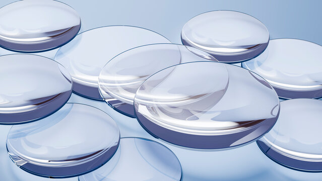 Transparent softgel capsules grouped on reflective surface