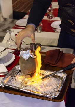 Testi Kebab is served with fire in a restaurant, Kebab braised in an earthenware pot, typical Turkish dish from Cappadocia, Istanbul, Turkey