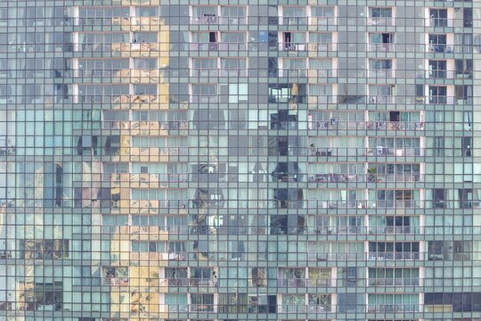 The distinctive fa&ccedil;ade of The River Condominium in Khlong San features a rhythmic pattern of glass, balconies and reflections. The vertical structure accentuates the height of the iconic Riverside skyscraper while capturing Bangkok's urban character, luxury residential projects on the Chao Phraya shore in Khlong Ton Sai, Khlong San, Bangkok, Thailand