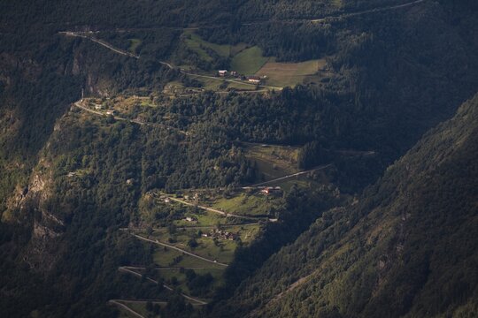 Farms line the switchbacks of the famous Fylkesvei 63 or Geirangervegen mountain road, Geiranger, Stranda, M&oslash;re og Romdal, Norway