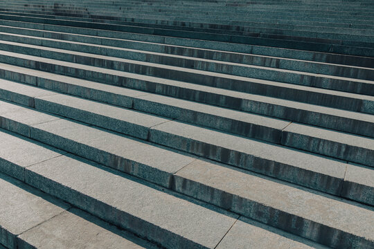 Long concrete steps ascend in a straight, orderly pattern