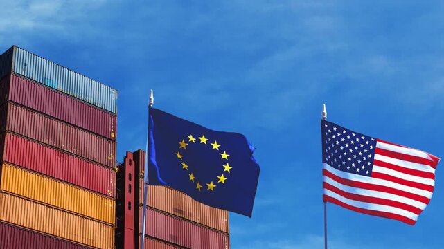 European Union and United States flags waving in front of cargo shipping containers under blue sky. 4K video representing US and EU international trade, export, and logistics relations.