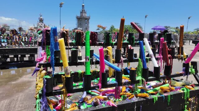 Colorful votive candles on stands at Simala Shrine in Cebu