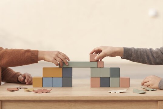 Children?s Hands Building Structure With Colored Wooden Blocks