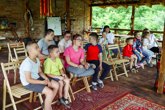 Children with Down syndrome are vacationing at a camp.