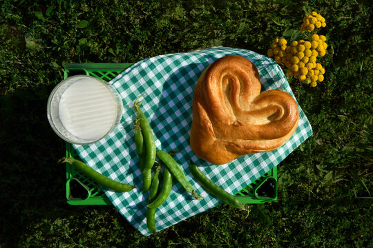 Golden Heart Shaped Bun with Milk and Green Peas for Summer Picnic
