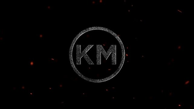 Letters KM inside a glowing circle with particles and sparks flying around