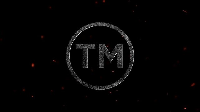 Tm Logo symbol glowing with embers and sparks flying in the air