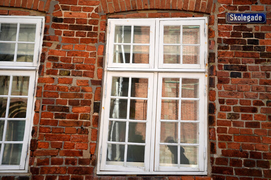 Historic Red Brick Building with White Windows on Skolegade Ribe