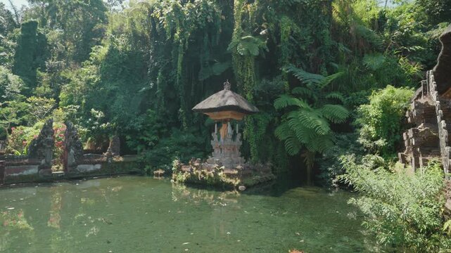 Sacred shrine and traditional Balinese temple architecture surrounded by tropical greenery at Pura Gunung Kawi Sebatu, Ubud