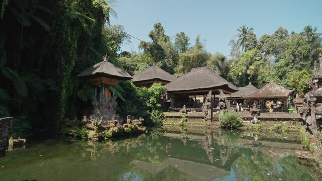 Sacred shrine and traditional Balinese temple architecture surrounded by tropical greenery at Pura Gunung Kawi Sebatu, Ubud