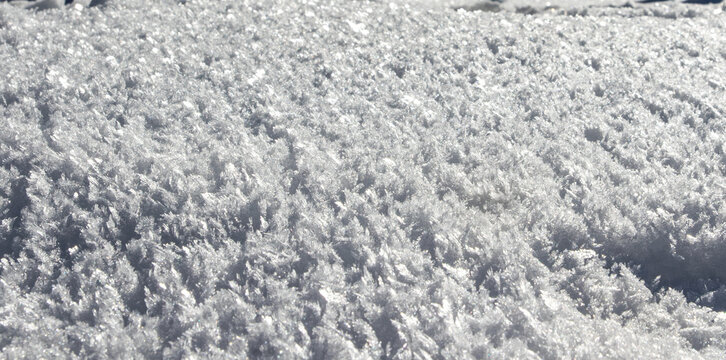 View of crystalline snow and frost patterns covering the ground in Arang Kel, Kashmir, Pakistan.