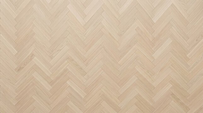 Top view of a light oak wooden parquet floor laid in a traditional herringbone pattern for a modern interior home design.