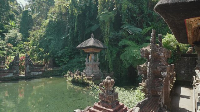 Sacred shrine and traditional Balinese temple architecture surrounded by tropical greenery at Pura Gunung Kawi Sebatu, Ubud