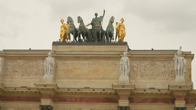 Historic Arc de Triomphe du Carrousel with Ornate Sculptures and Quadriga in Paris, France