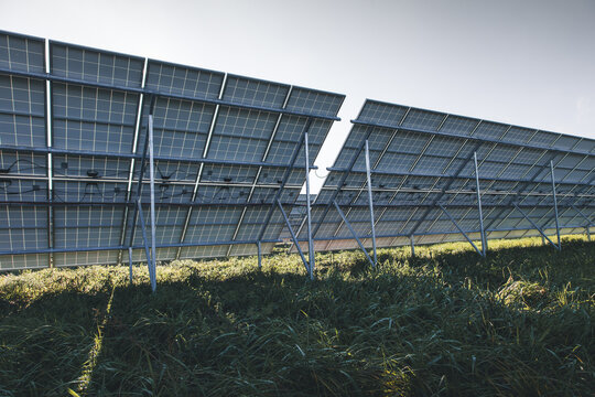 View of solar panels installed in a grassy field with metal support structures under a clear sky in Tartu County, Estonia.