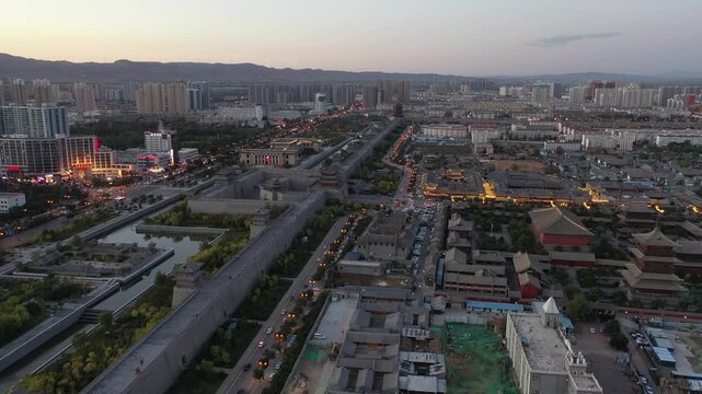 Aerial View of Ancient City Wall and Moat in Xi'an, China at Dusk