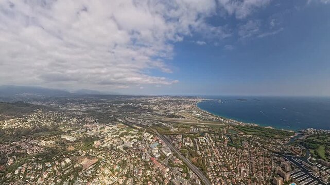 Aerial view approaching Cannes-Mandelieu Airport and surrounding French Riviera landscape, taken from plane