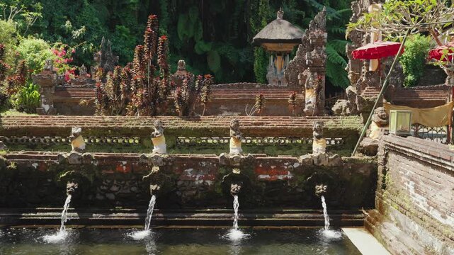 Sacred water pools at Pura Gunung Kawi Sebatu Hindu temple in Ubud, Bali, Indonesia