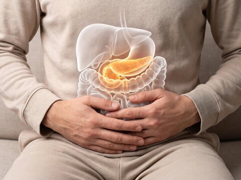 Man suffering from stomach pain with illuminated glowing pancreas and digestive system anatomy overlay, concept of pancreatitis, pancreatic cancer, digestion issues, and healthcare