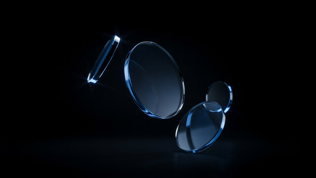 Floating circular glass lenses with blue light reflections on a dark black background surface