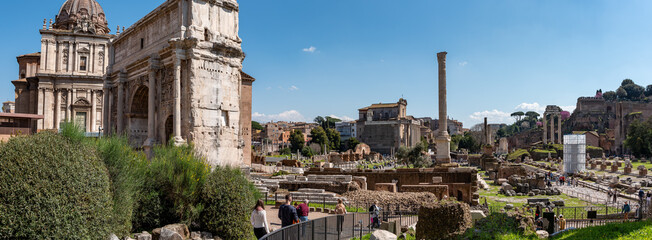 Rome, Italy - April 09, 2026 - Panoramic view of the Arch of Septimius Severus, Column of Phocas, and Basilica Julia in Rome © imagoDens