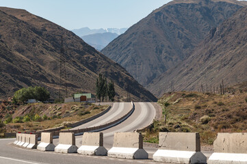  Mountain road through Boom Gorge in Kyrgyzstan. Travels in Central Asia. © Natalia