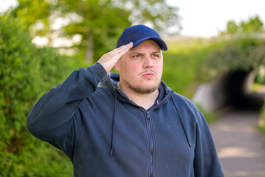Young Man Giving Respectful Salute
