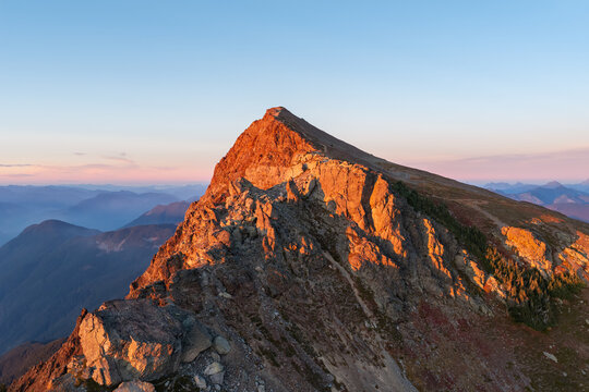 Golden Sunset on Mountain Peak Ridge Above Valleys Near Chilliwack British Columbia Canada