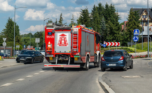 Polish fire truck Straż Pożarna rear view driving on a road in Zakopane
