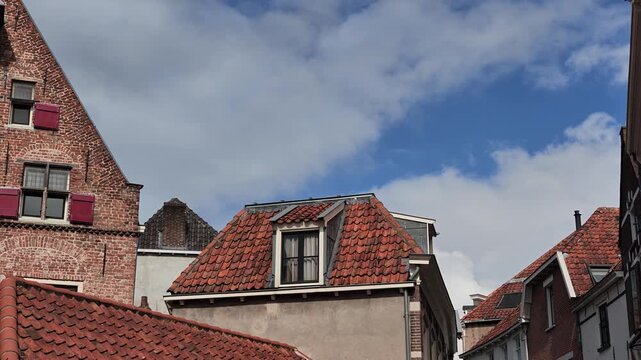 Panning view along historic old Dutch house facades in Deventer