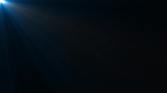 Seamless animation of light rays. White and blue rays of light on a black background glow from the top left of the frame. Looping animation of light. Isolated animation of white light rays.