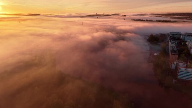 Yellow bright sunrise flying above clouds