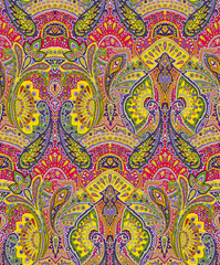 Seamless repeating pattern with paisley motifs placed at different angles, balanced by smaller floral elements and filler © Venkatsai