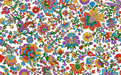 Seamless repeating pattern with paisley motifs placed at different angles, balanced by smaller floral elements and filler © Venkatsai