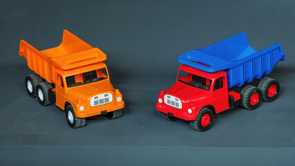 Two colorful plastic toy dump trucks. © lapis2380