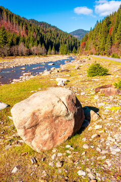 landscape with mountains, forest and a river in front. beautiful autumn scenery in the valley of Synevyr national park, Ukraine