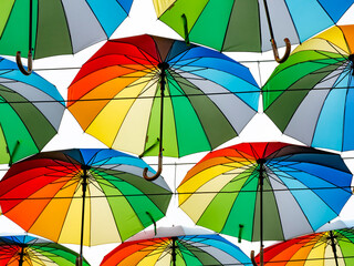 background of multi-coloured umbrellas © Polivan