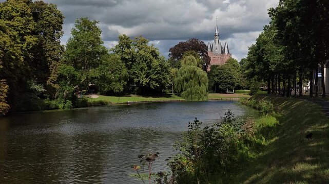 Scenic view of historic Sassenpoort gatehouse and city canal in Zwolle