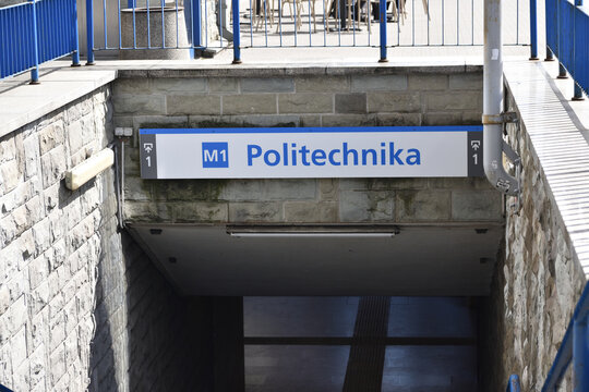 Politechnika M1 subway station entrance, signboard with pointers. WARSAW, POLAND - APRIL 30, 2026