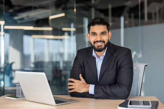 Indian businessman smiling working in modern office