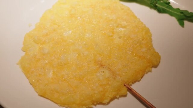 Crispy parmesan cheese lollipop appetizer rotating