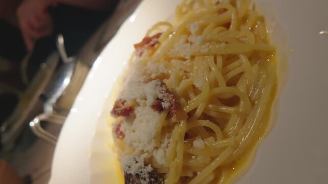 Delicious italian spaghetti carbonara with fresh pepper
